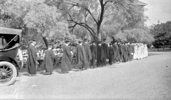 Young people lined up at a commencement ceremony